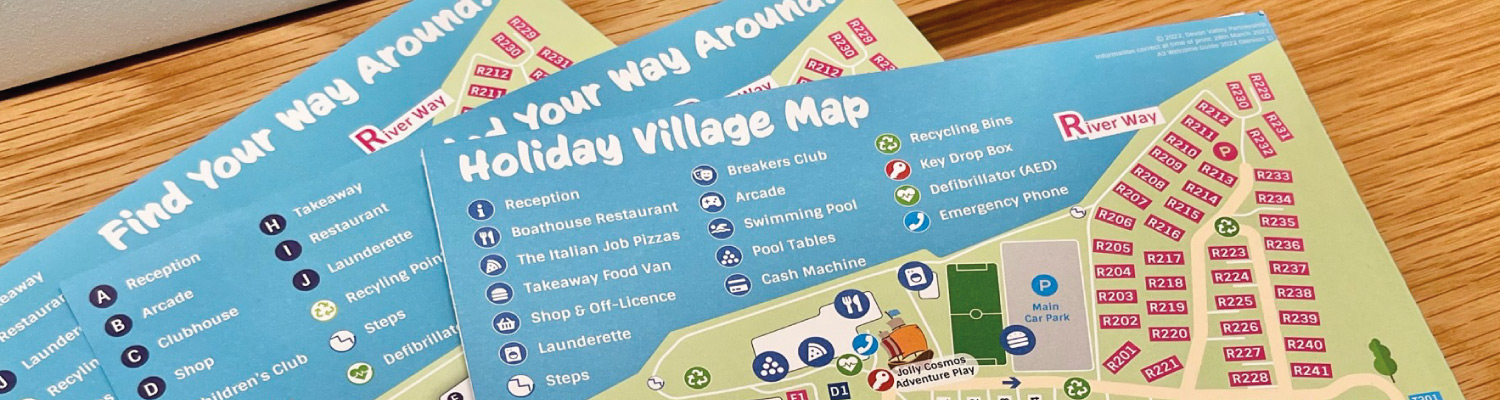 Pile of printed holiday park maps